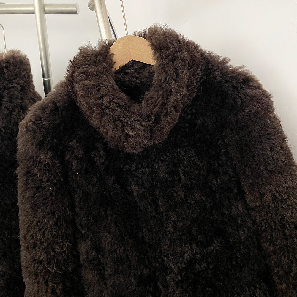 Close-up of the cozy stand-up roll collar design on the real sheep wool coat