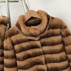 Close-up of soft high stand fur collar on two-tone striped rabbit fur coat