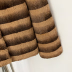 Detail shot of layered gradient stripe natural rabbit fur sleeve texture