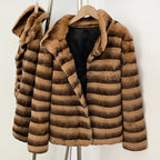 Open front view showing smooth black lining of striped rabbit fur short coat