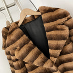 Close-up of oversized notched lapel on two-tone striped real rabbit fur coat