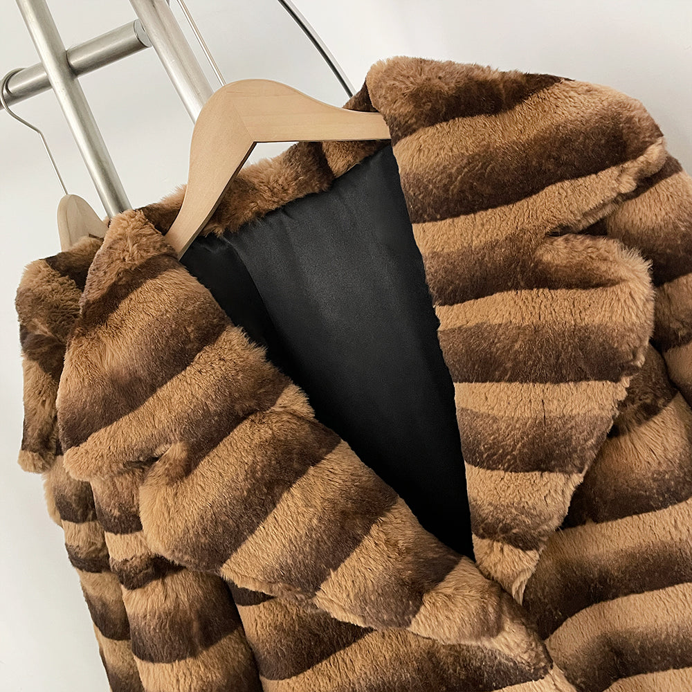 Close-up of oversized notched lapel on two-tone striped real rabbit fur coat