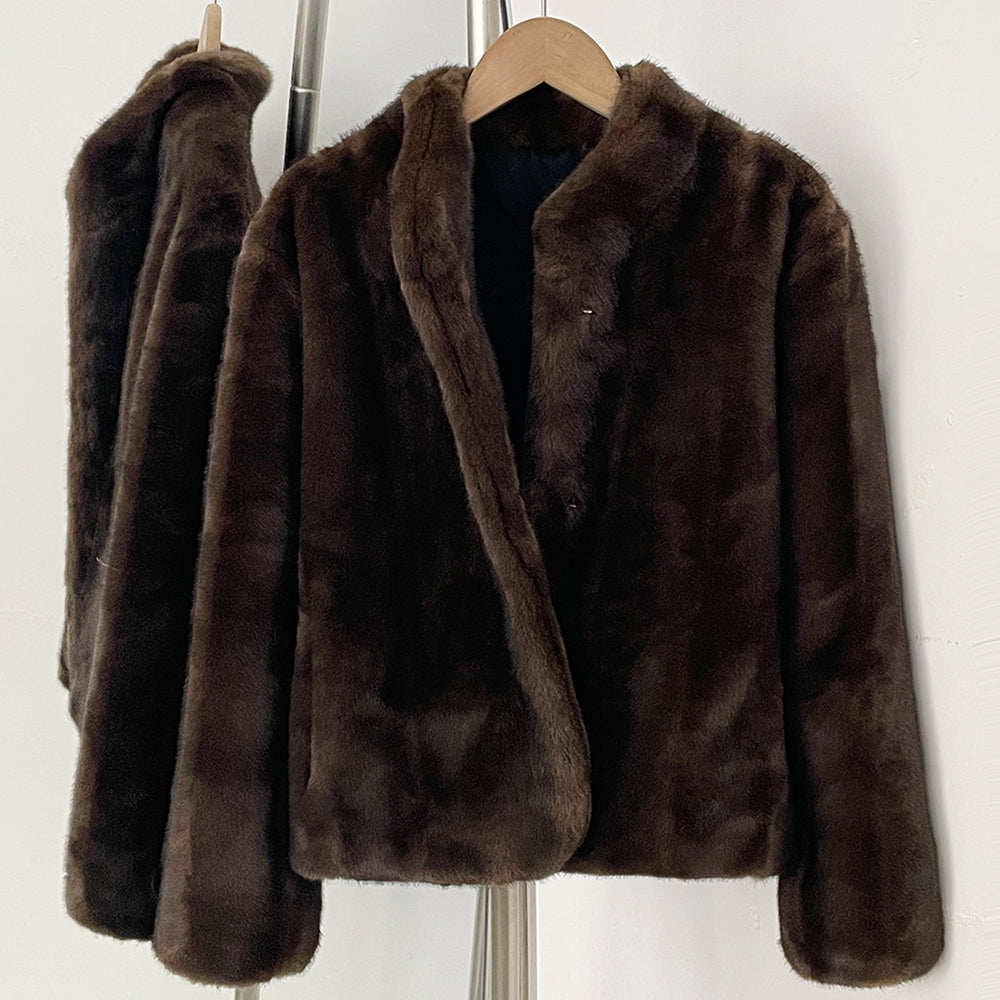 Close-up plush stand collar detail on brown faux mink coat