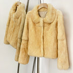 Side hanging shot of sweet minimalist cream yellow rabbit fur winter jacket