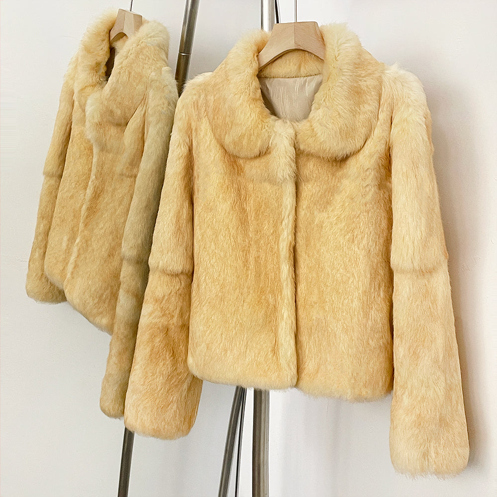 Side hanging shot of sweet minimalist cream yellow rabbit fur winter jacket