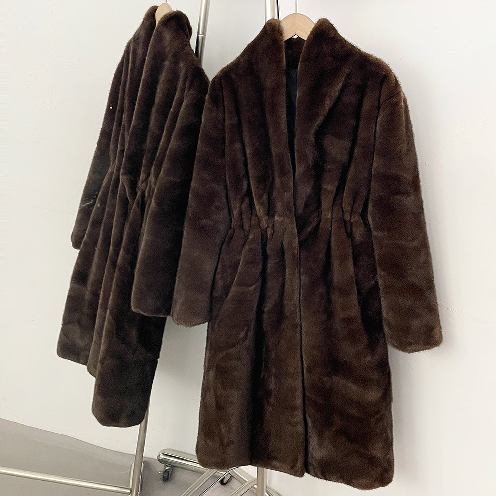 Two matching long faux mink coats showing relaxed fit silhouette