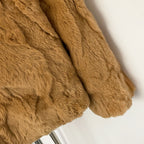 Detail shot of fluffy natural rabbit fur sleeve texture