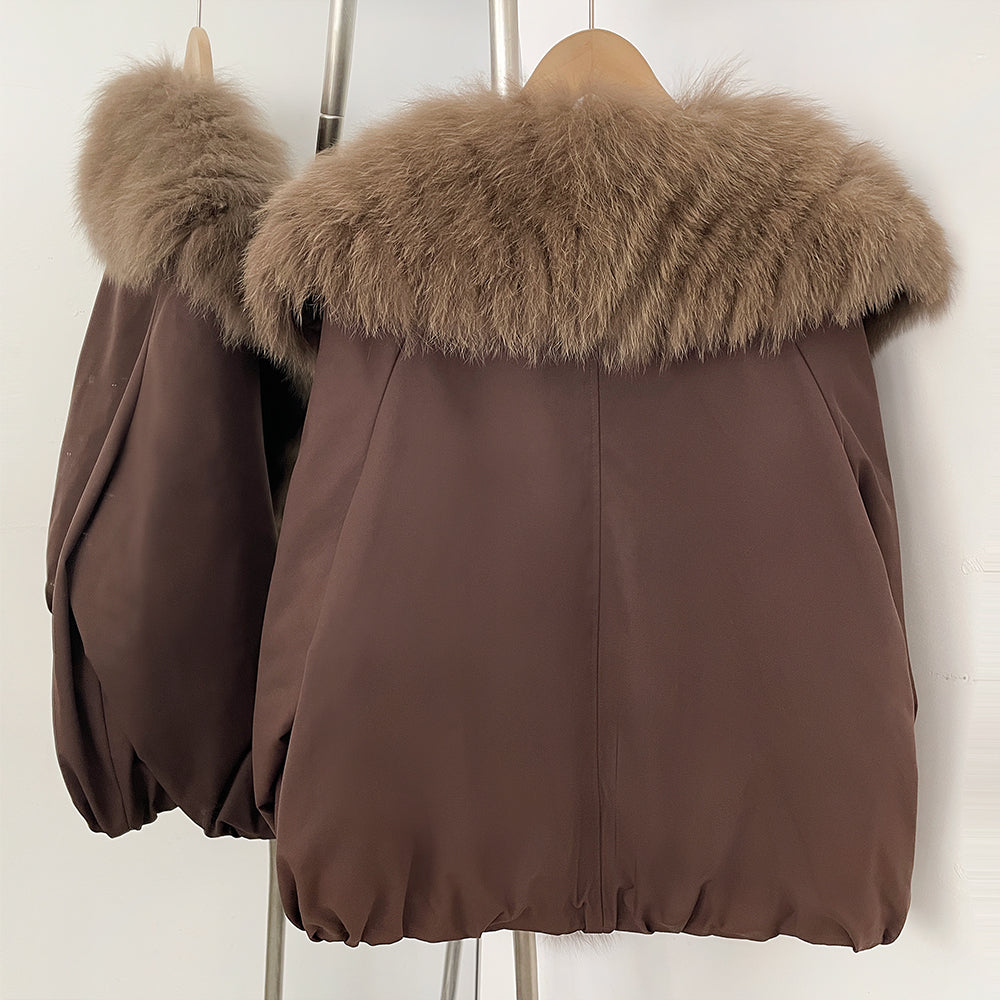 Back view of relaxed cropped duck down parka with large fox fur collar