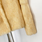 Texture shot of silky natural genuine rabbit fur sleeve hem