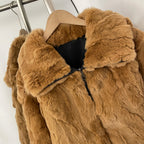 Close-up of oversized fold zip collar on solid rabbit fur coat