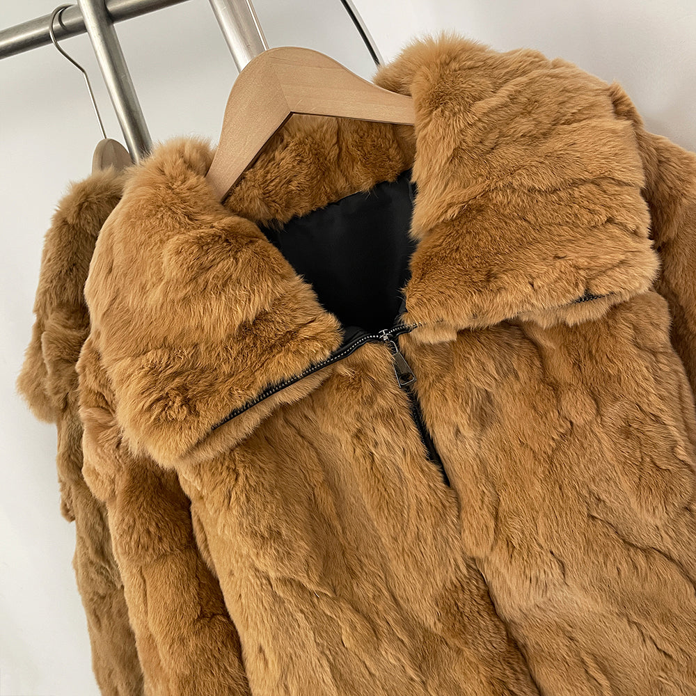 Close-up of oversized fold zip collar on solid rabbit fur coat