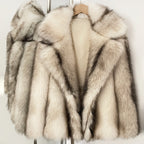 Luxury cream faux fur jacket with realistic dark tips and dramatic lapel