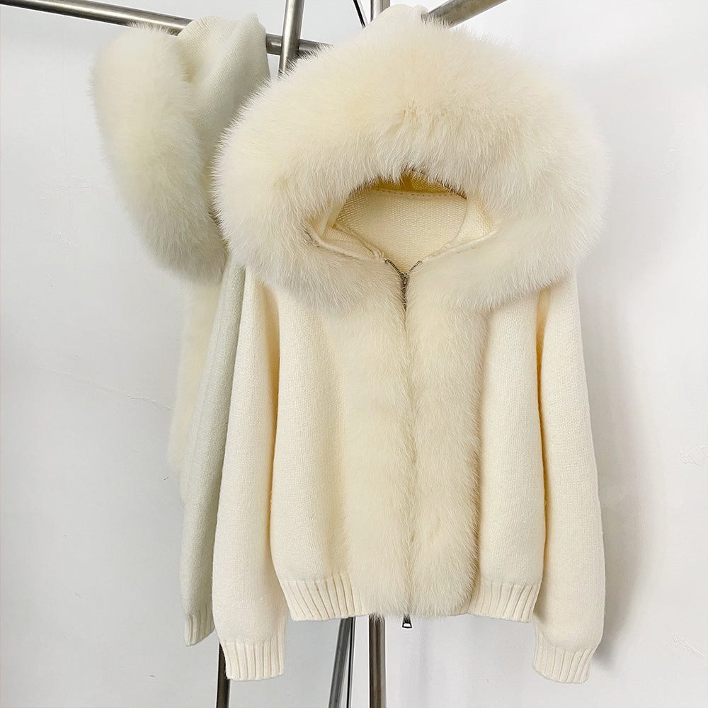 Luminous cream white luxury fur trimmed sweater in a high-end ski resort style