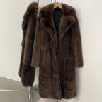 Rich coffee brown luxury long-line faux fur coat with notch lapel on a hanger