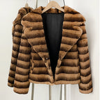 Open front view showing smooth black lining of striped rabbit fur blazer