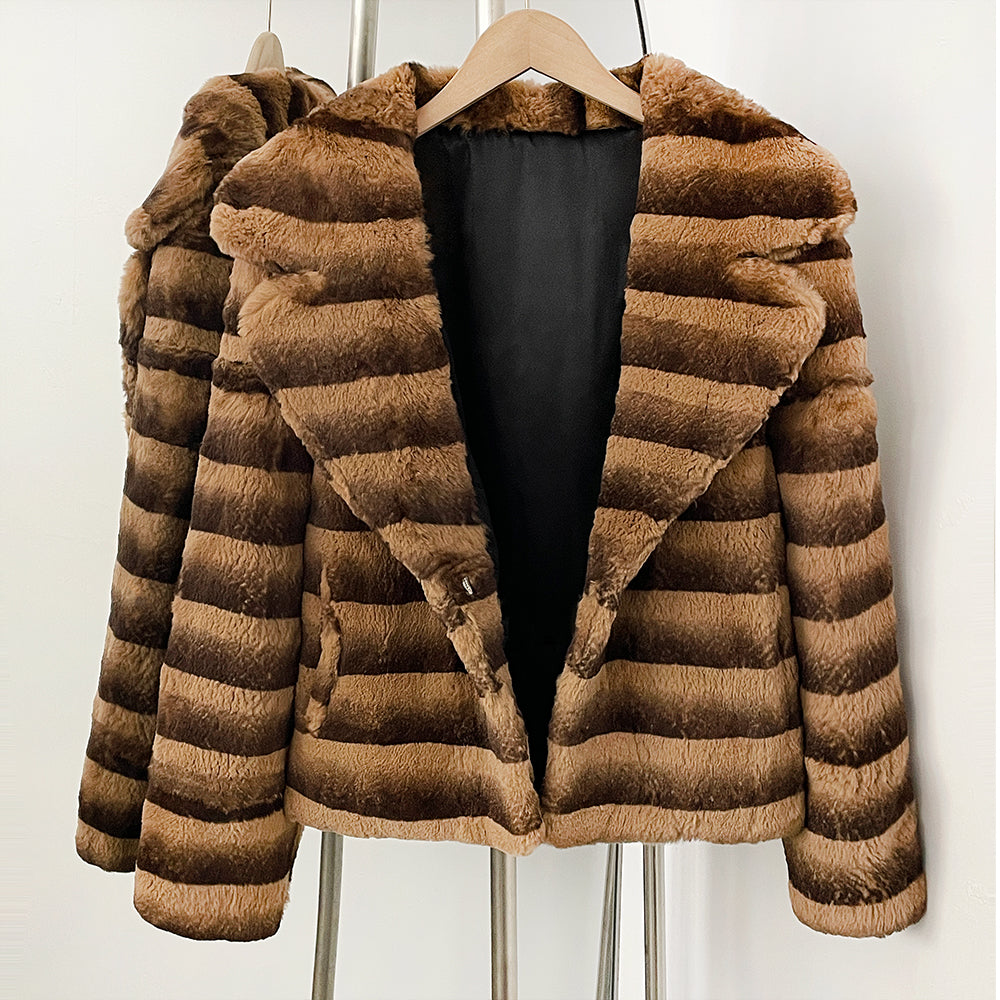 Open front view showing smooth black lining of striped rabbit fur blazer