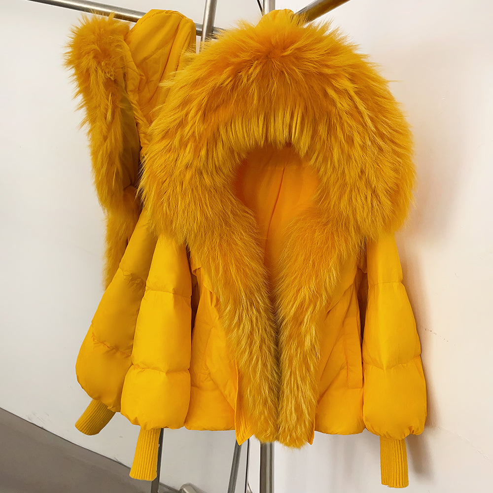 Bold electric yellow winter puffer jacket featuring a huge real fur shawl collar