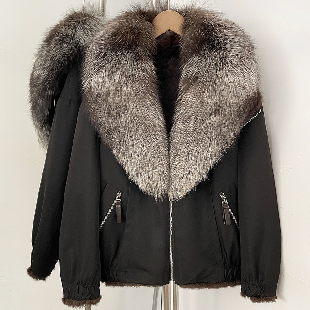 Front view of black bomber jacket featuring a voluminous silver fox fur collar