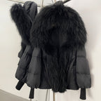 Sleek midnight black 90% down puffer jacket with a colossal black real fox fur collar