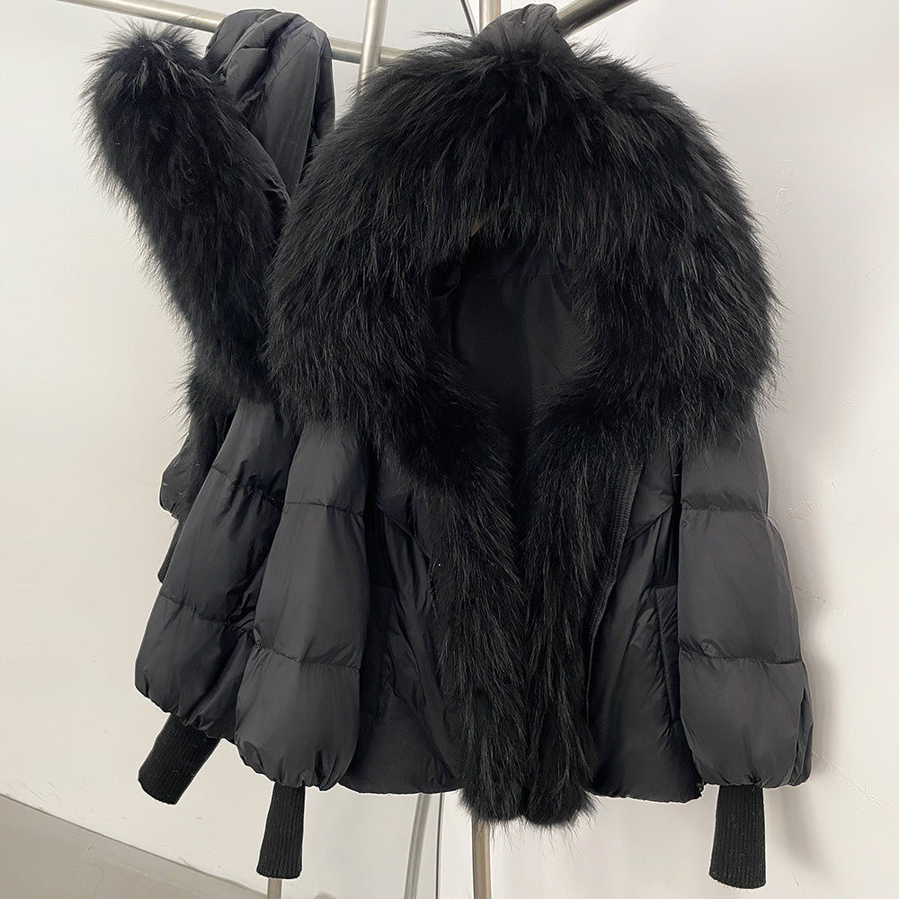 Sleek midnight black 90% down puffer jacket with a colossal black real fox fur collar