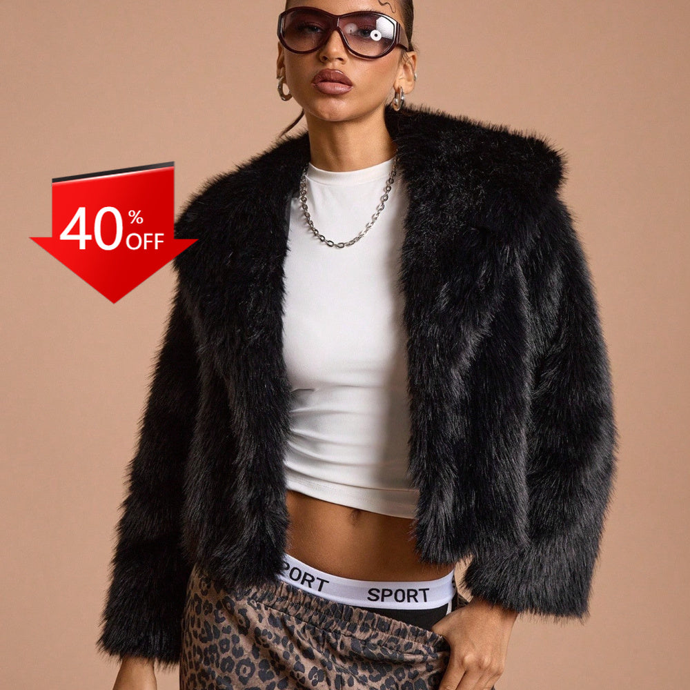 Midnight black short vegan fur coat styled with leather boots and a designer bag