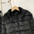 Close-up of velvet-soft black rex rabbit fur and stand collar design