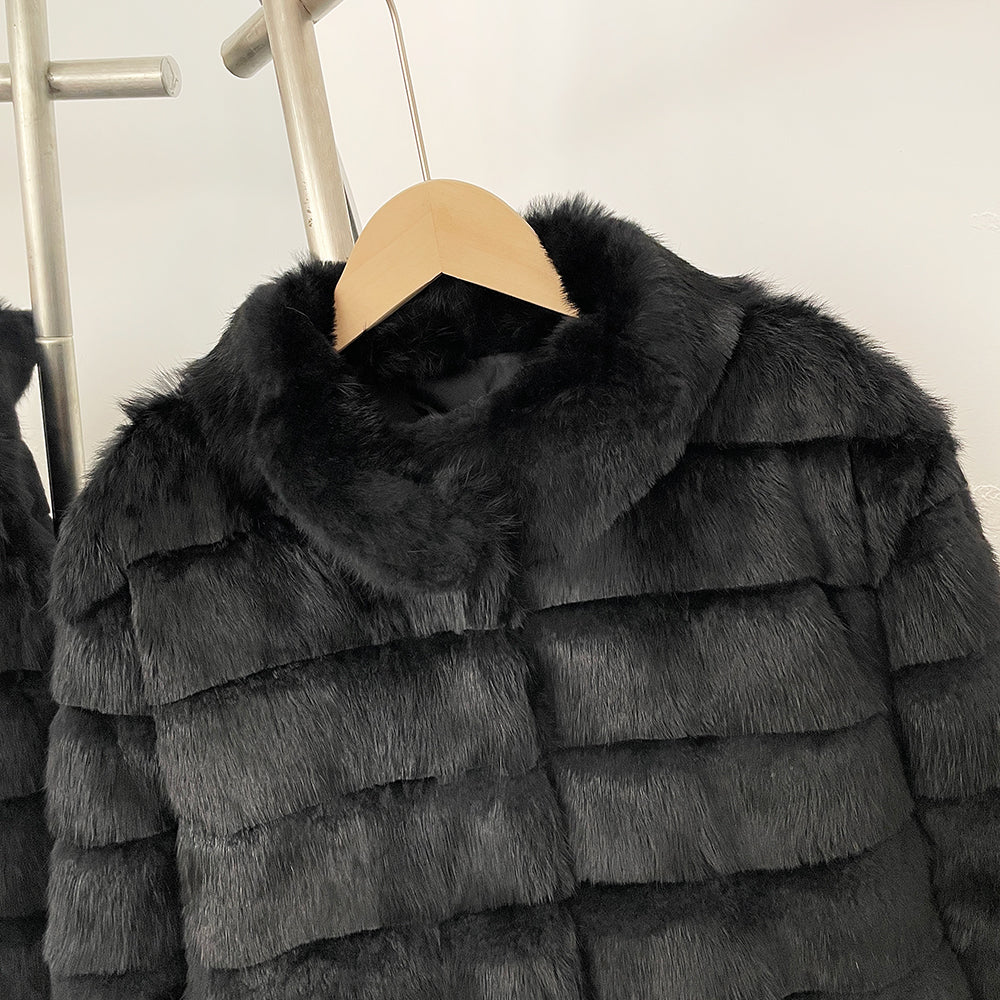 Close-up of velvet-soft black rex rabbit fur and stand collar design