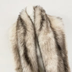 Close-up of the plush oversized shawl collar and long-line silhouette of a luxury fur vest