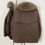 Back view of relaxed short parka with oversized fox fur collar
