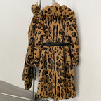 Back full view of knee-length leopard print real rabbit fur long coat