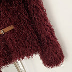 Detail shot of adjustable leather metal buckle belt on faux fur jacket