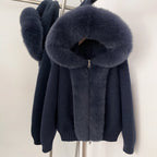 Elegant navy blue knitted jacket with matching blue-toned real fox fur hood and trim
