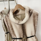 Close-up of the plush funnel roll neck design on a luxury vegan fur vest