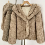 Back view of a luxury hooded faux fur jacket with realistic grey and brown multi-tonal texture