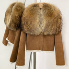 Women's khaki suede coat featuring a massive natural raccoon fur shawl collar