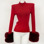 Vibrant cherry red knit sweater with oversized luxury fox fur sleeve trim