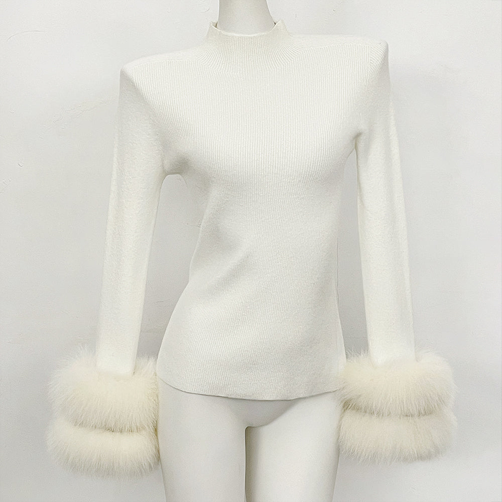 Front view of white ribbed knit mock neck top with matching white fox fur cuffs