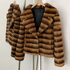 Side front hanging shot of vintage brown striped genuine rabbit fur coat