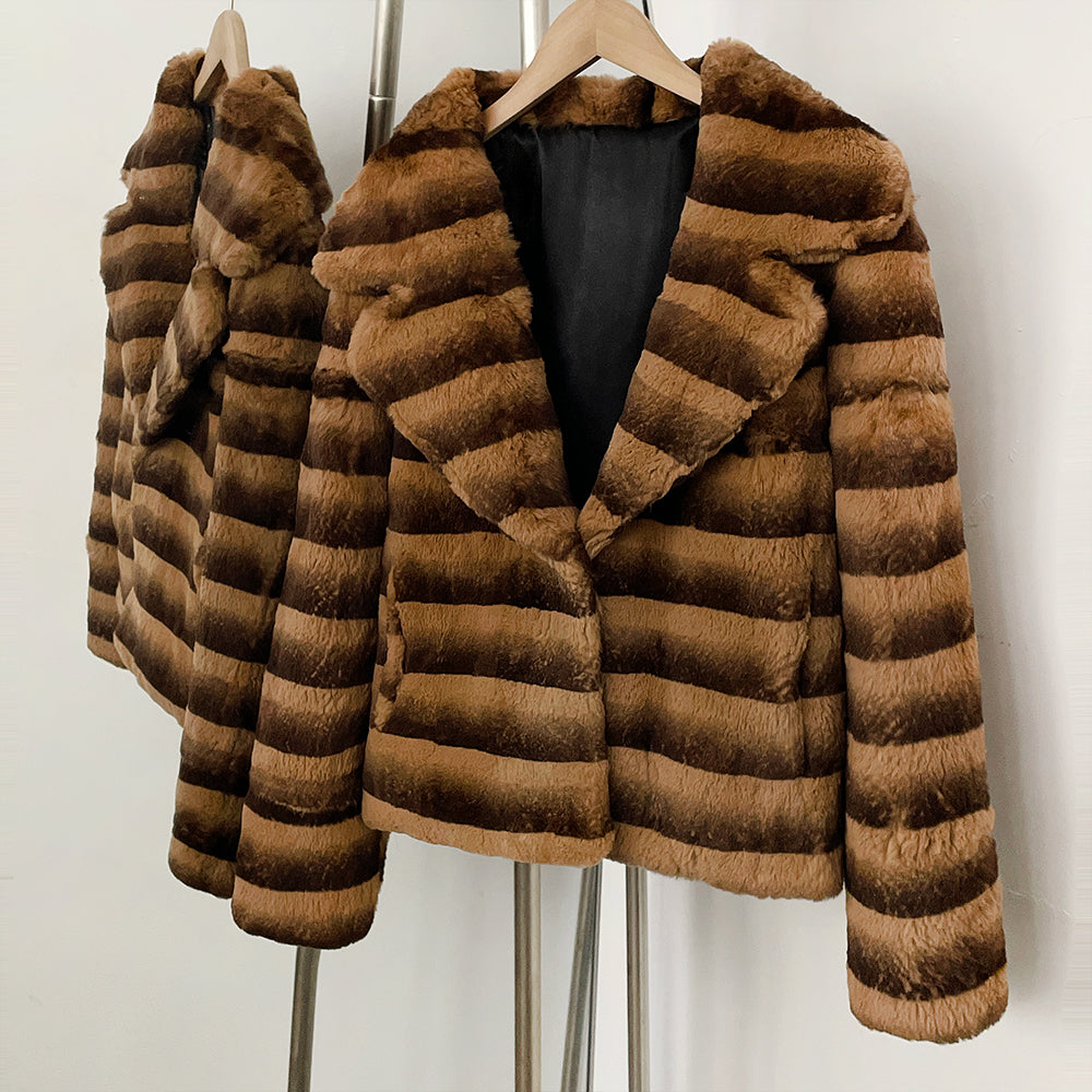 Side front hanging shot of vintage brown striped genuine rabbit fur coat